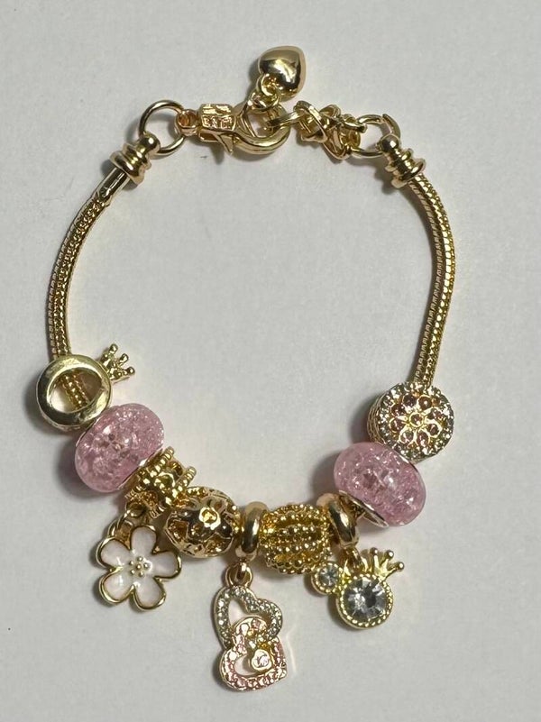 Elegant Gold and Pink Charm Bracelet
