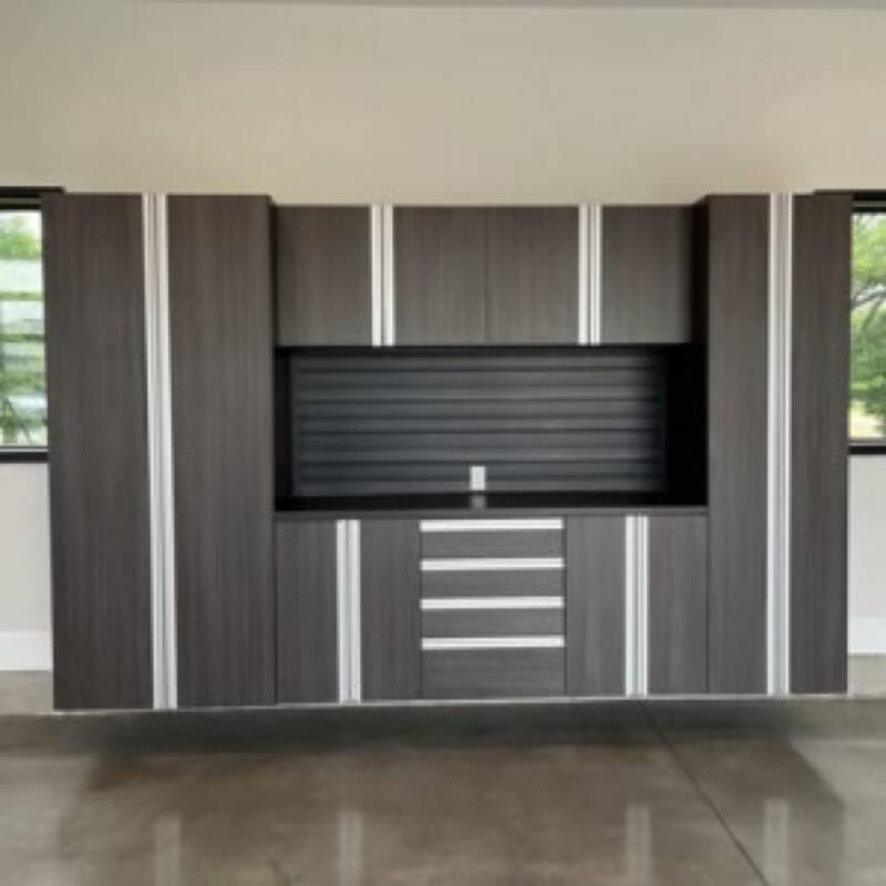 Command Center package: dark full-wall unit with tall cabinet, three uppers, drawer bank, door cabinets, and dark slatwall