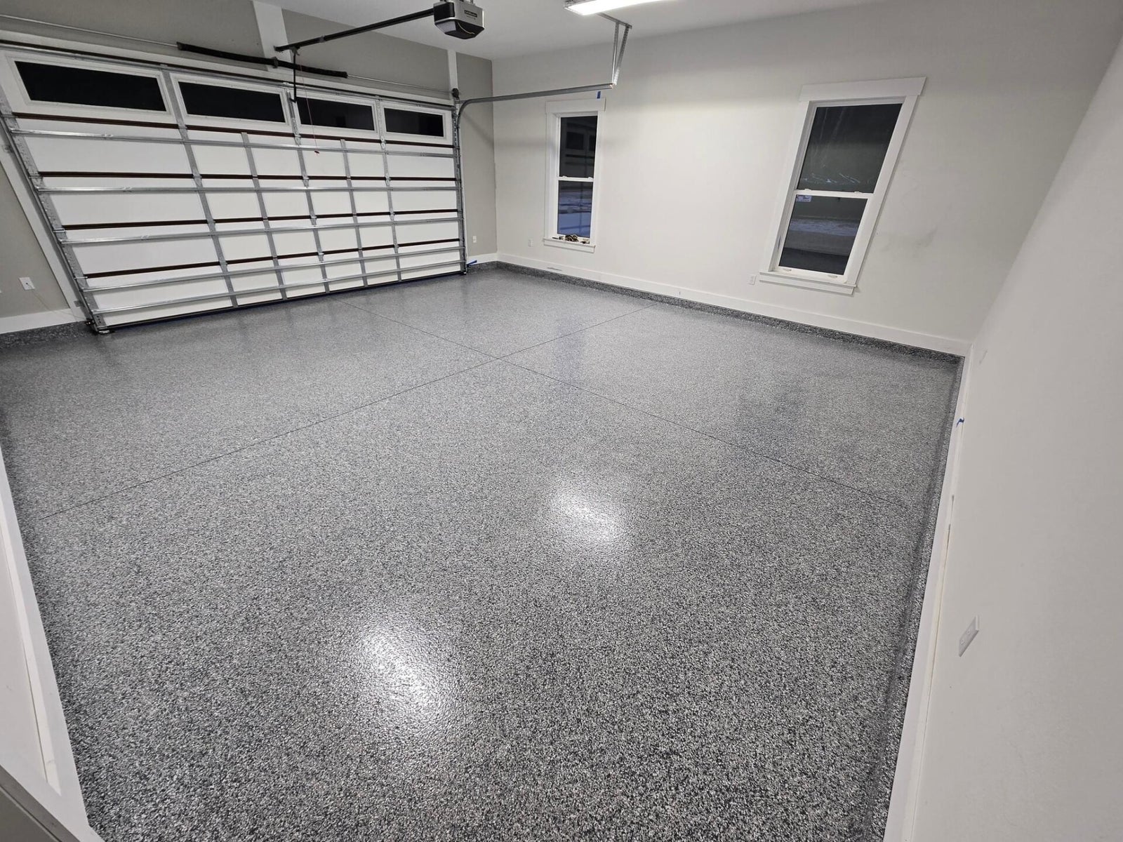 Finished gray flake polyaspartic garage floor in Metro Detroit