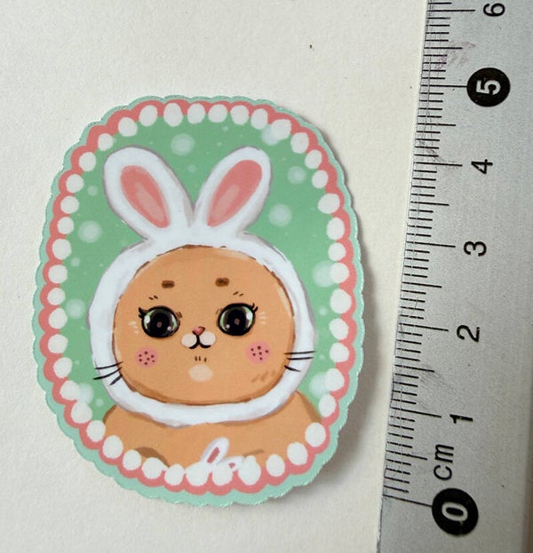 small sticker <cat wears bunny hat>