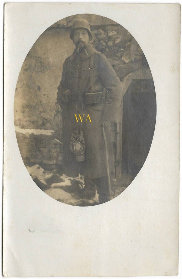 German soldier with gas mask and M16 helmet. Dated and named.