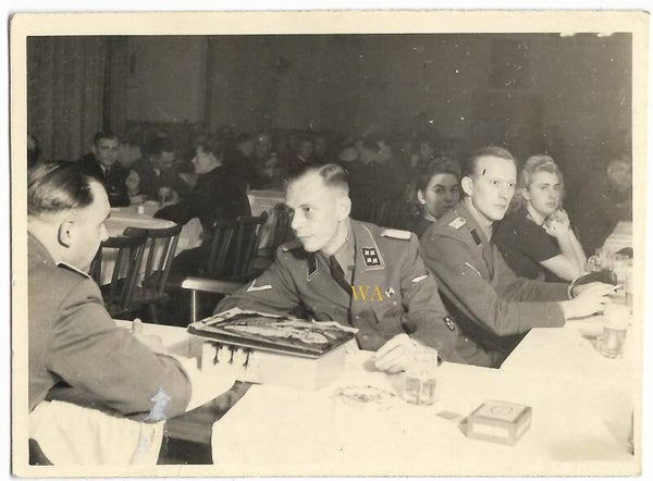 SS / SD-Sturmbahnführer at the table. Photo very probably taken in Poland.