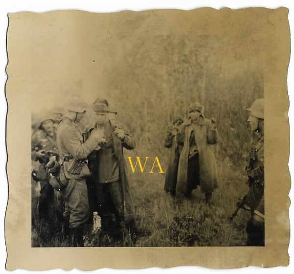 Just captured Russian soldiers wearing fur hats