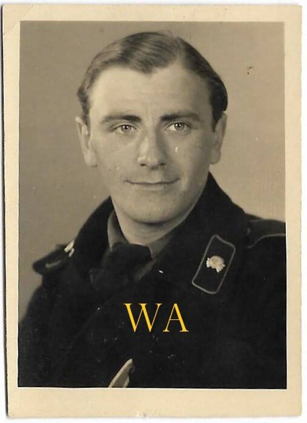Close-up photograph of a Panzermann in black uniform wearing the Iron Cross.