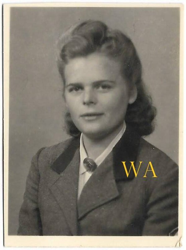 Close-up photo of a lady in RAD uniform with brooch