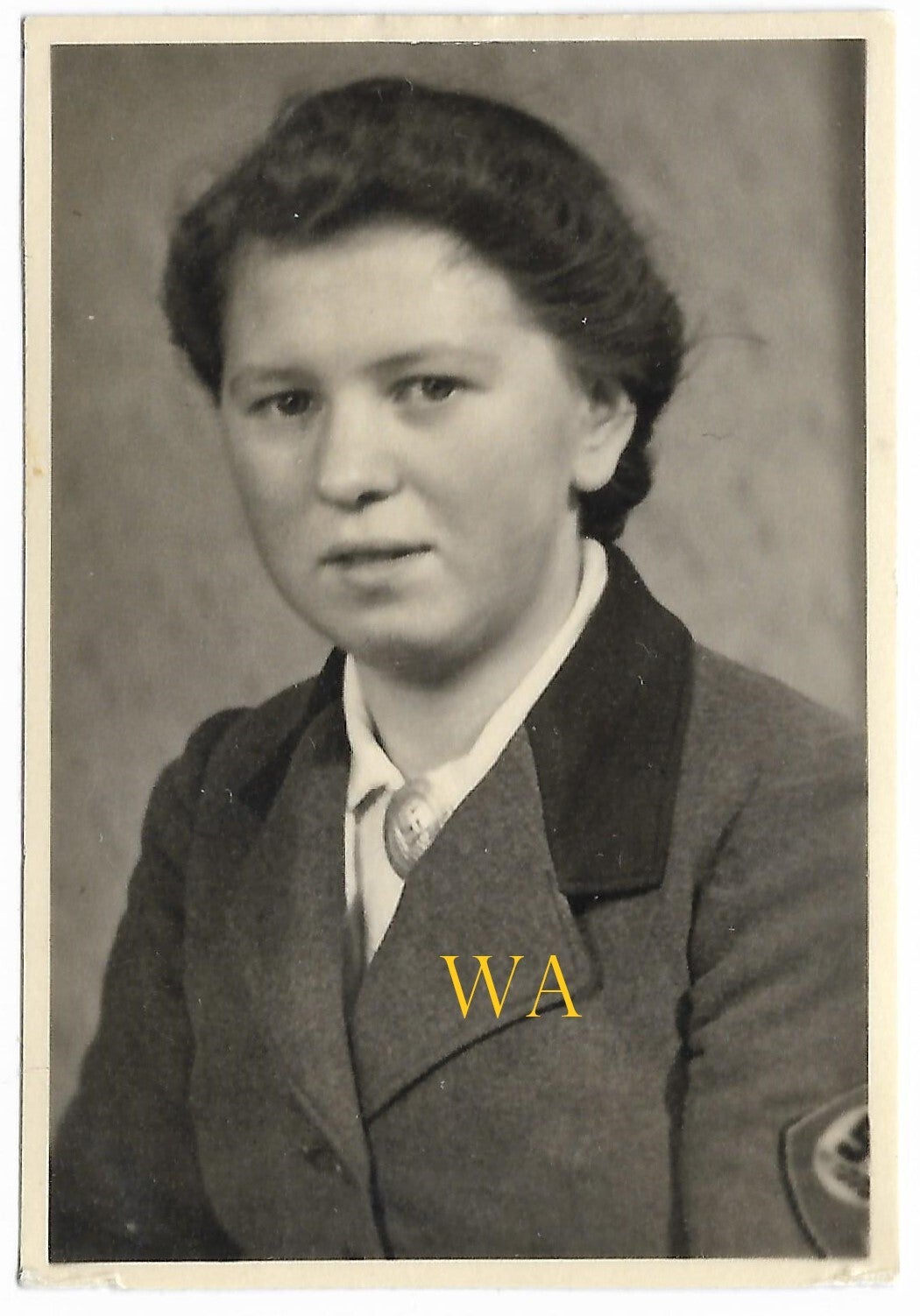 Passport photo of an R.A.D. girl with visible brooch and sleeve emblem