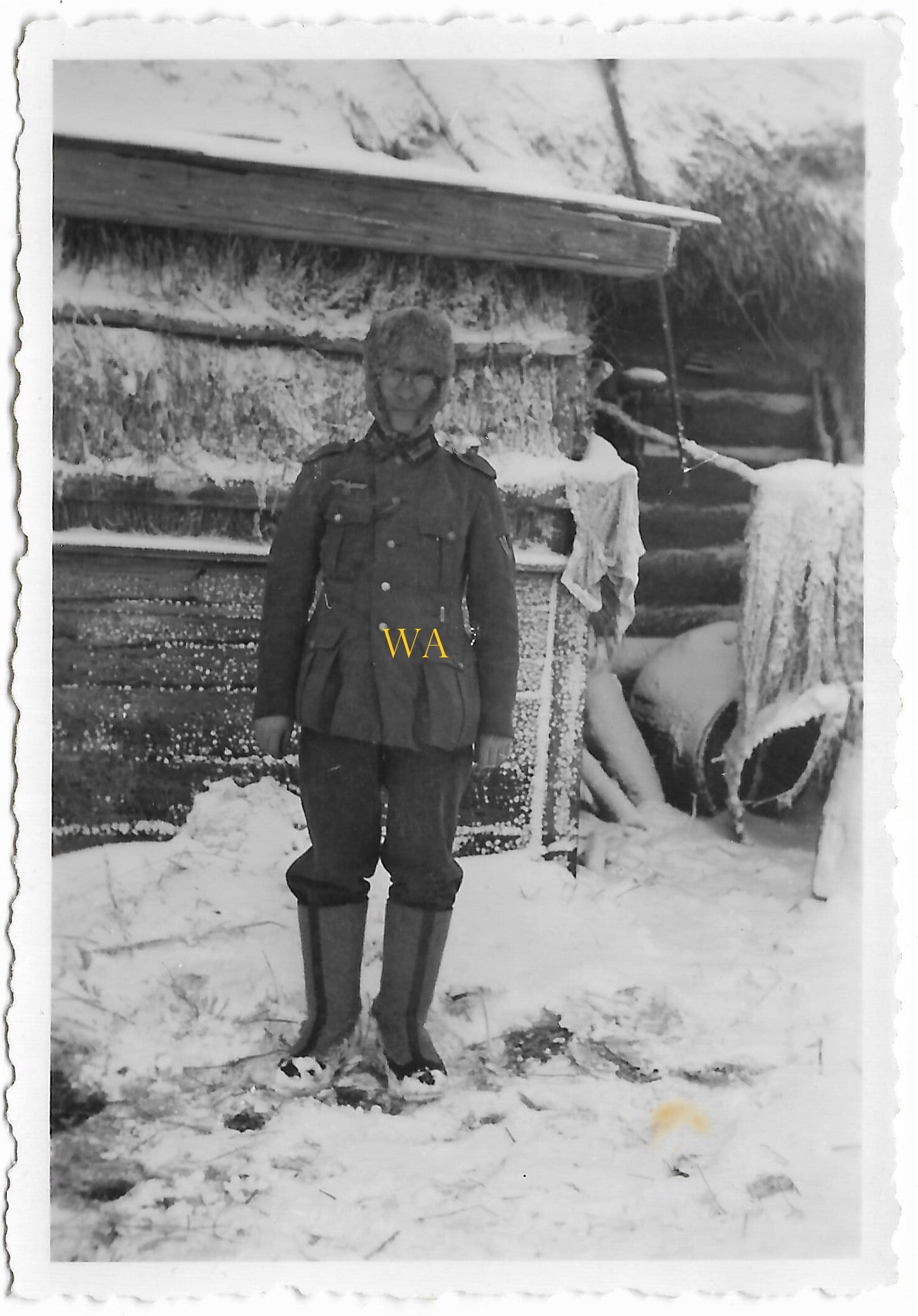 German Soldier wearing a 'fur hat' and winter boots in extreme conditions