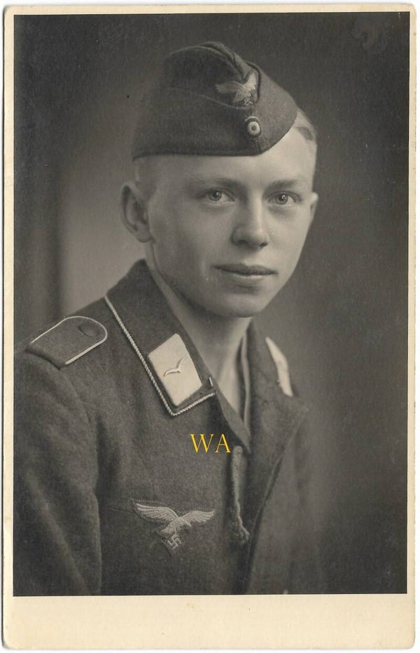 Studio portrait of a German Luftwaffe Flieger with Luftwaffe Schiffchen (field cap) 1943