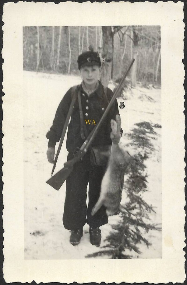 German youth boy with a shot rabbit ( Deutsches Jungvolk).