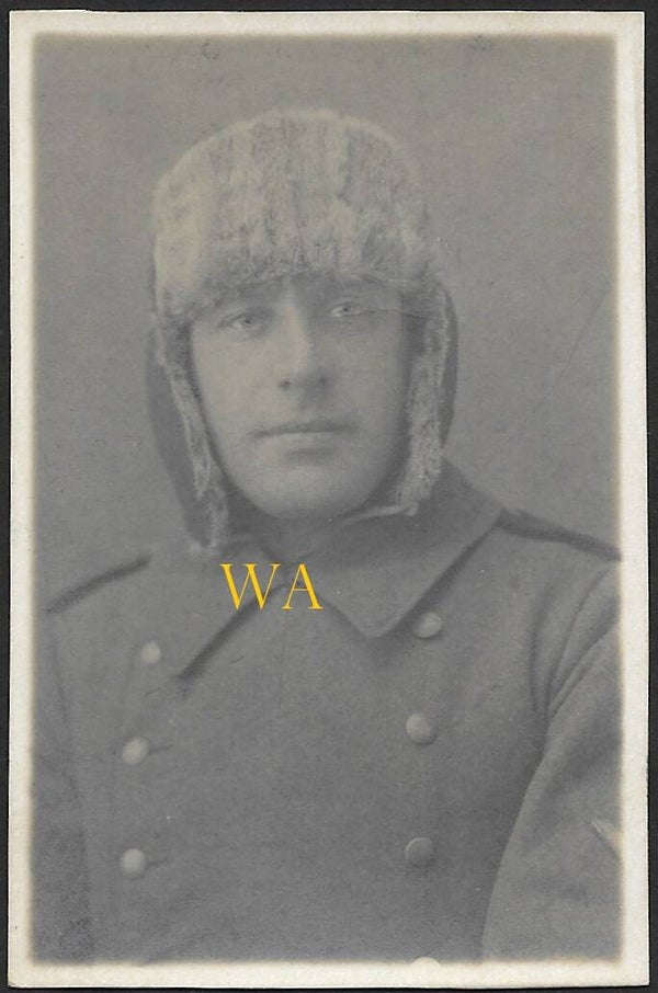 German soldier wearing a fur hat / fur cap for harsh winter conditions