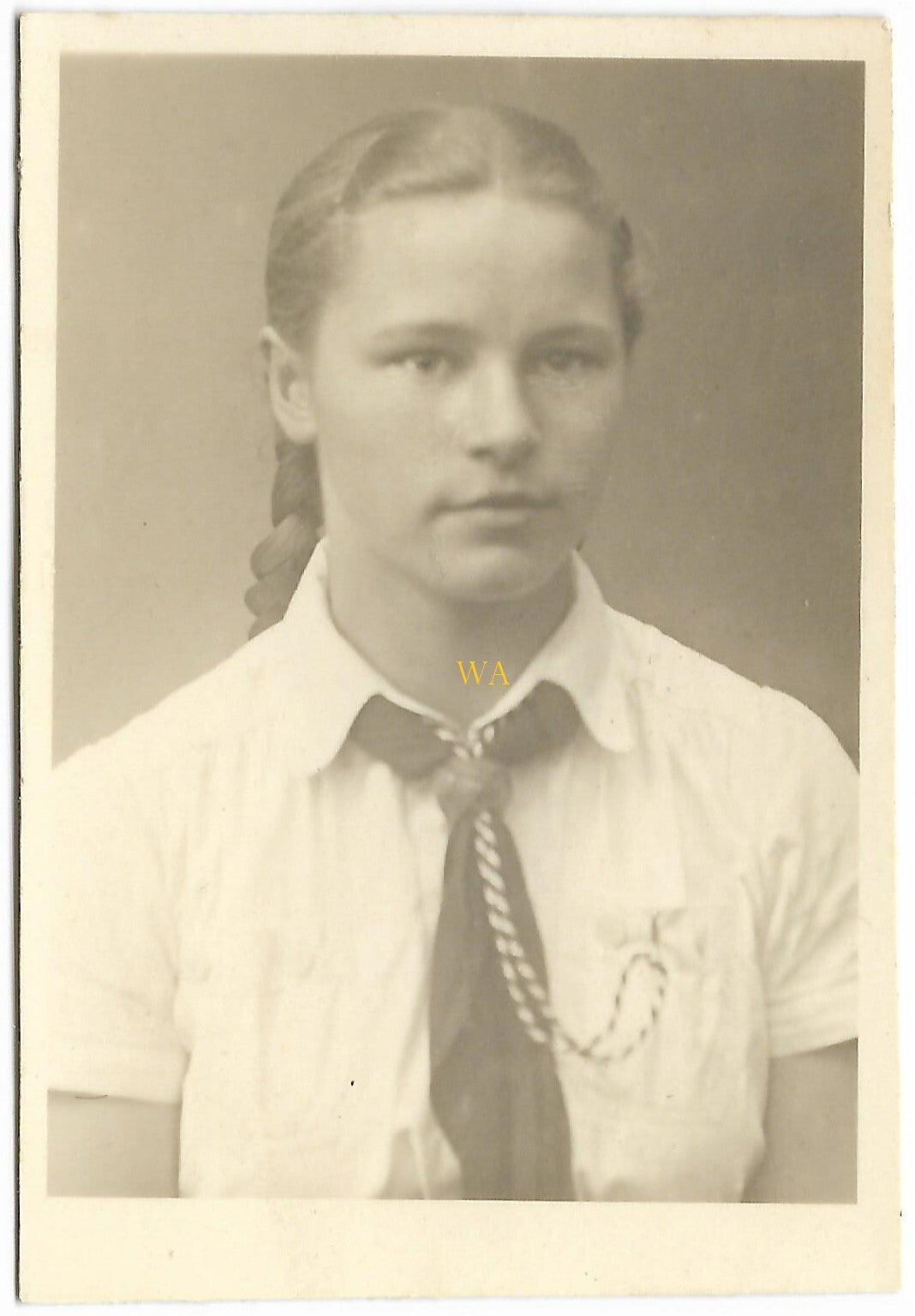 Portrait photo of a young BDM girl with pigtails.