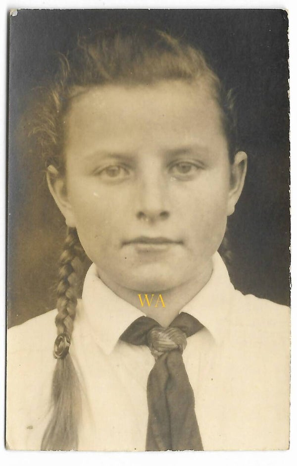 BDM photo of a young girl with tail and knot.