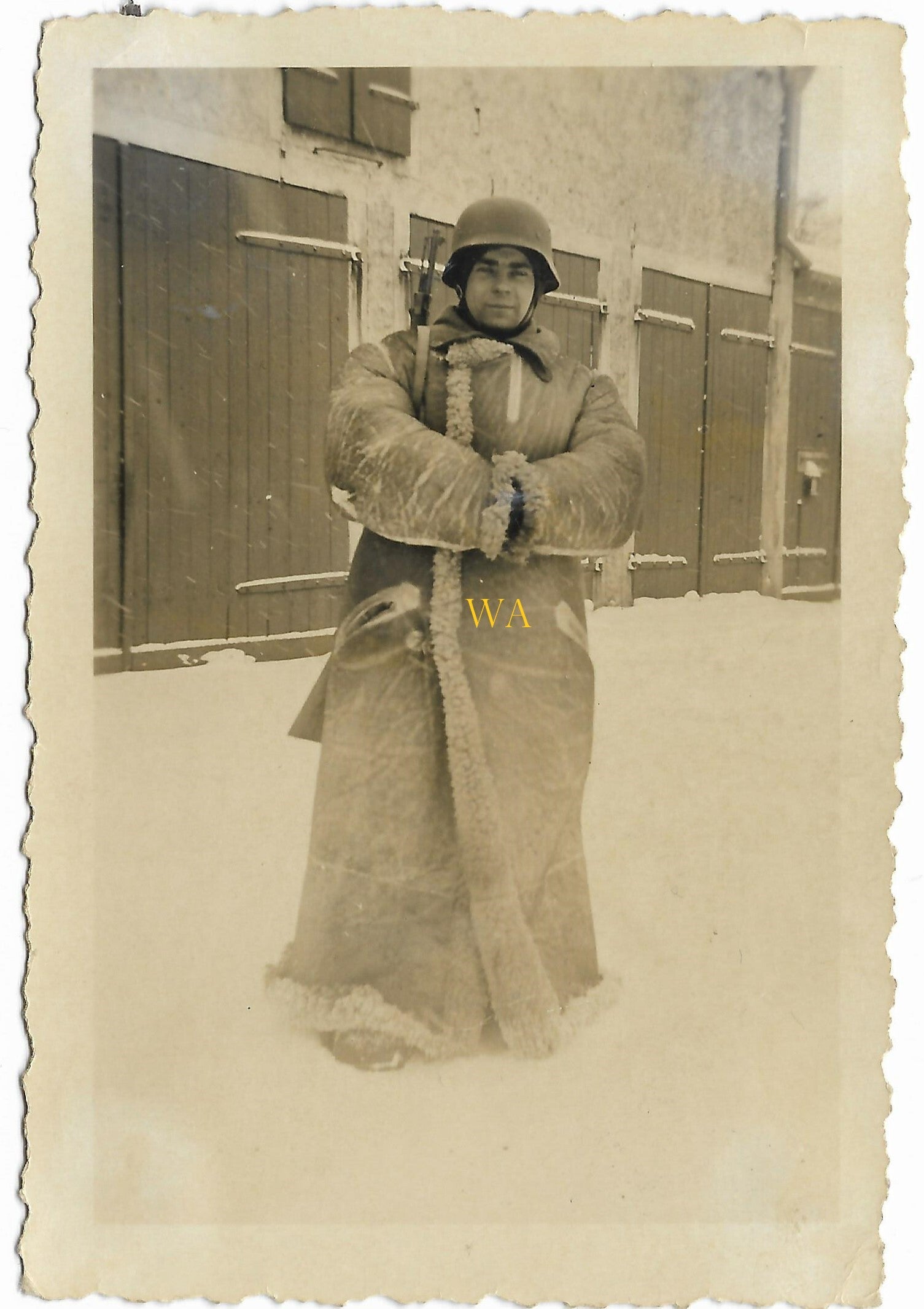 German soldier with Steel helmet and furry winter coat.
