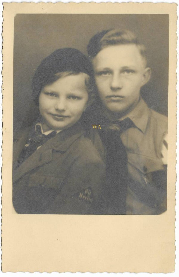 Studio portrait BDM girl and HJ boy with 'Ost Berlin dreieck'.