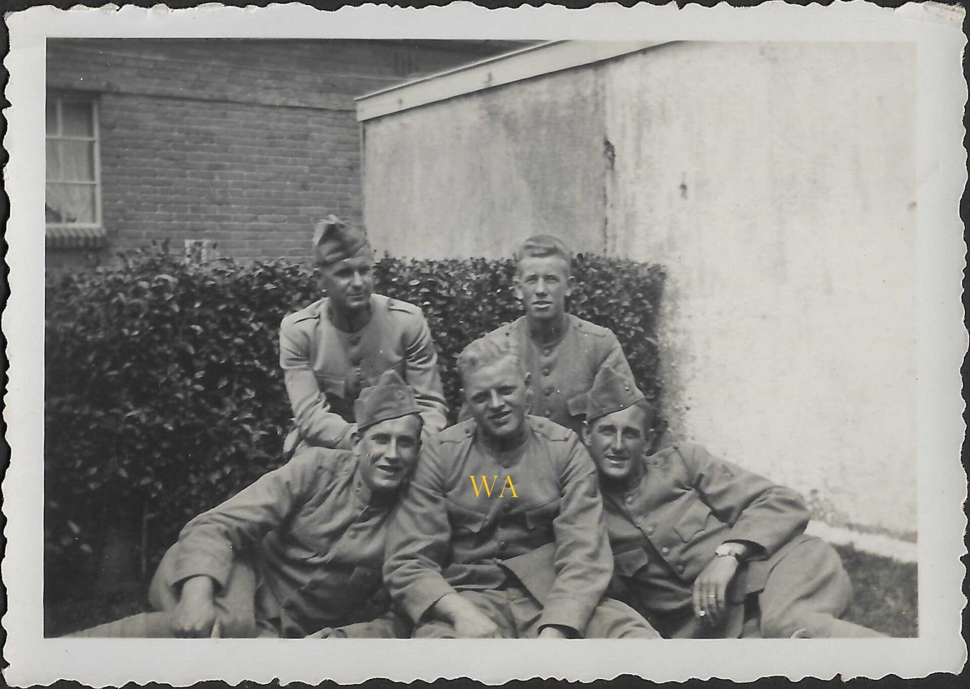 Group of Dutch soldiers in grey 1912 uniforms and 1927 field caps.