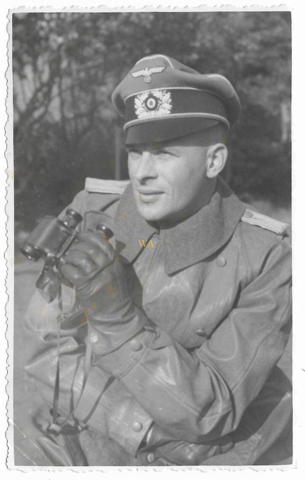 German with leather jacket and binoculars