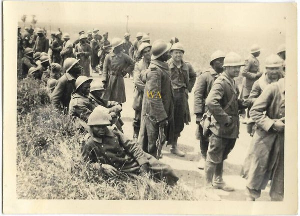 French and French colonial prisoners of war by the side of the road 1940