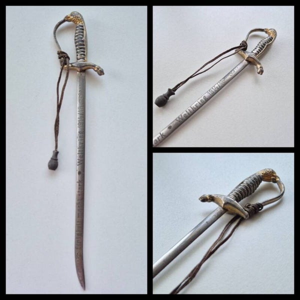 WW1 Miniature sabre used as a letter opener, inscribed with ‘Weltkrieg 1914/1916’