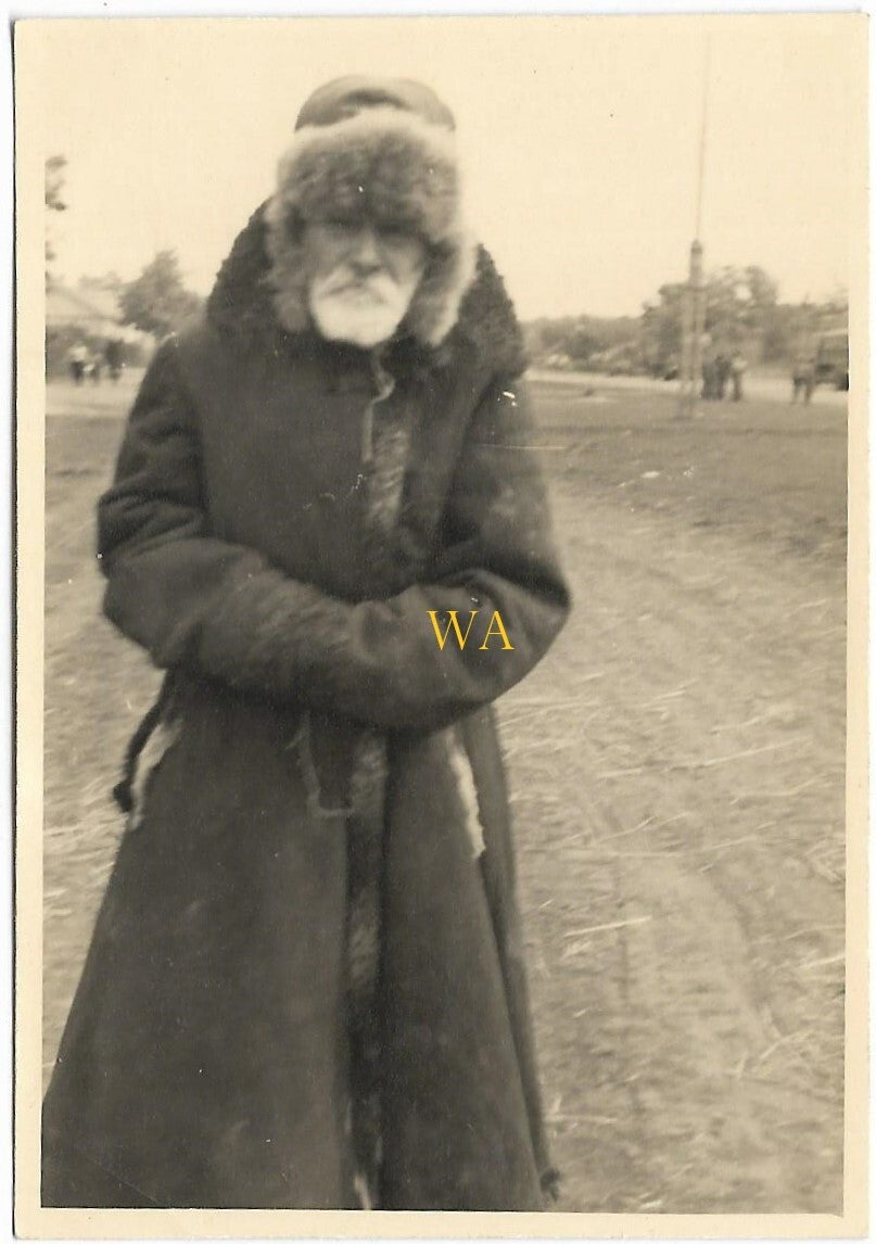 Photograph of a Russian man in winter clothing (native).