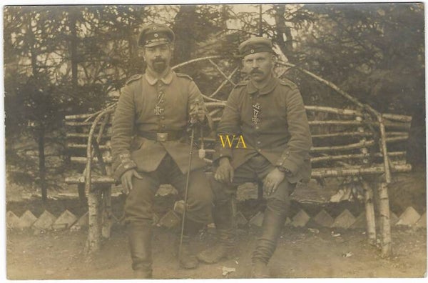 Photo card of 2 soldiers with the iron cross on their chest.