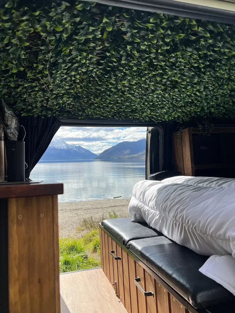 Demeter luxury campervan parked lakeside during a road trip