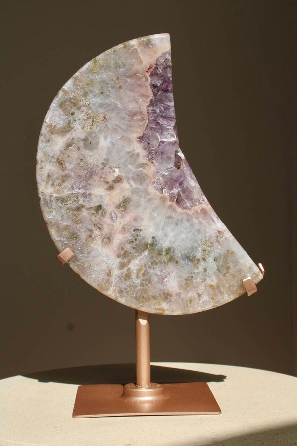 Pink amethyst moon on rotating stand