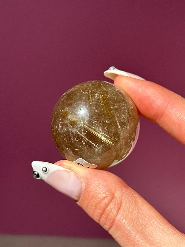 A grade Rutile in Quartz sphere