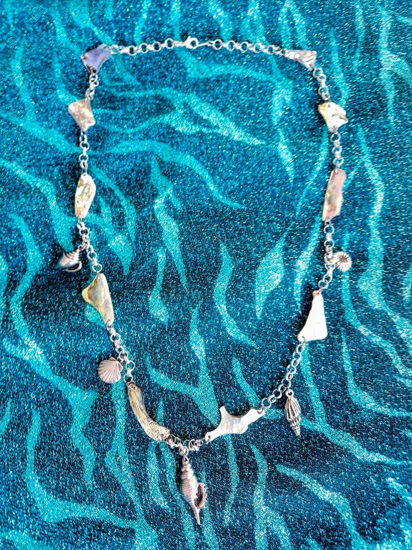 Woman's abalone shell and seashell charm necklace