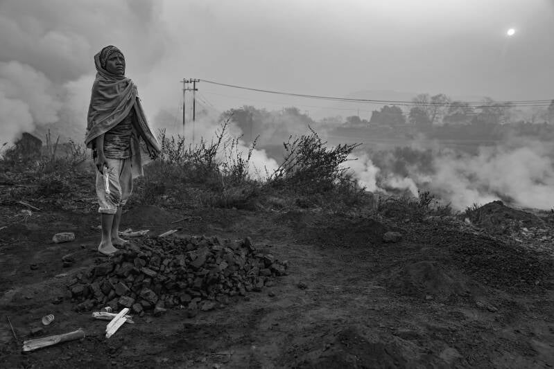 an arresting photo from the coal fields of India, read about what life is like in the burning fields of Jharia in this informative article and photo essay,