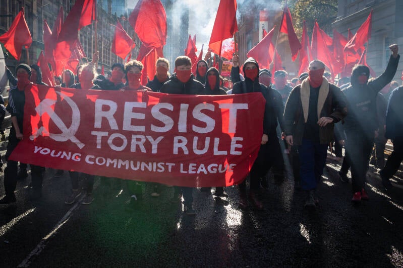 Documentary photographer Andy Barton, captures the mood of the Young Comminist League, London, England. 2023.