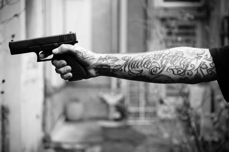 documentary image by French photographer Brice Gelot, this project looks at gangs and tatoos, his text talks about his intentions as a post modern documentary photographer,