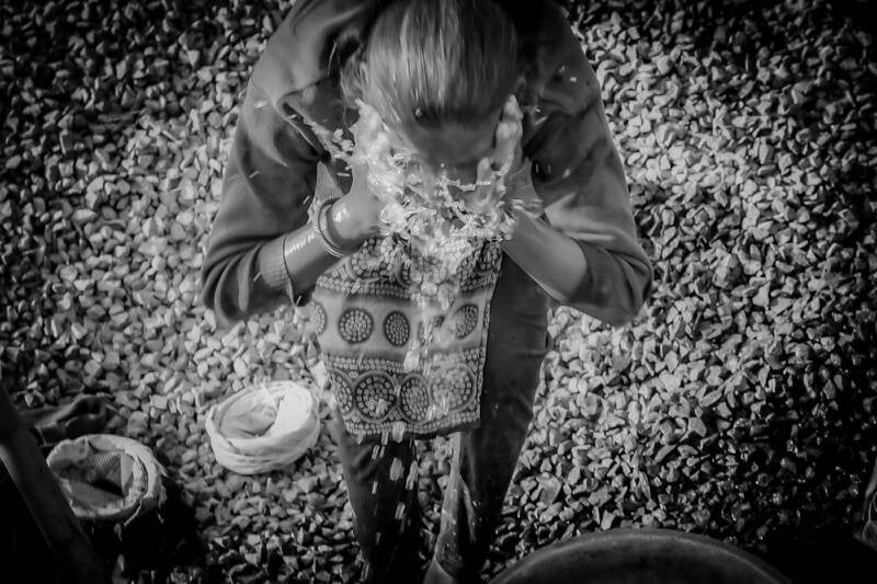 documentary photo of female construction worker on building site, in India by Bharat Patel,