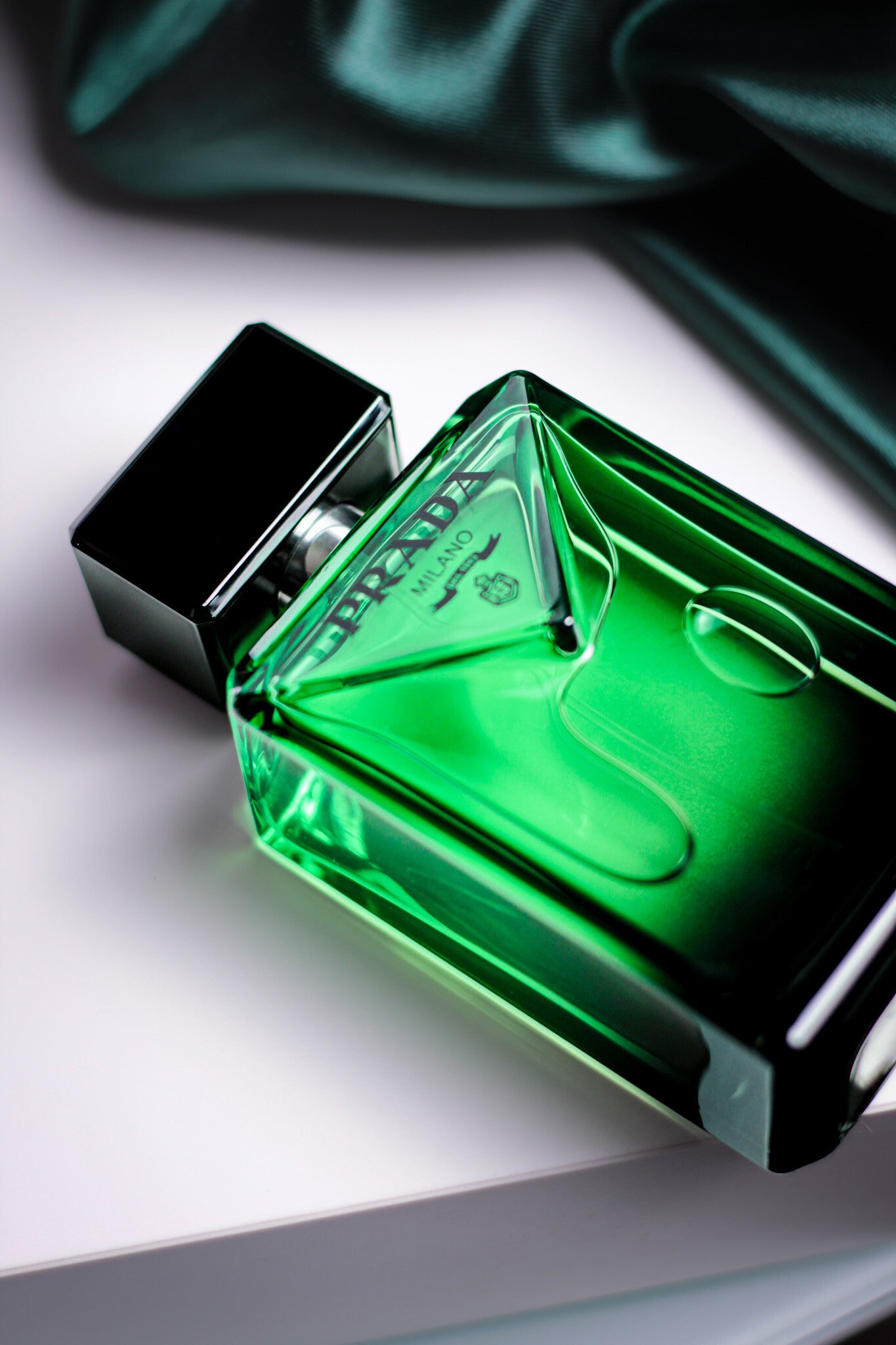 Elegant green Prada Paradigme bottle showcased for a detailed fragrance review