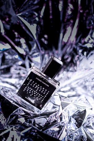 1. Fragrance bottle on silver crinkled surface