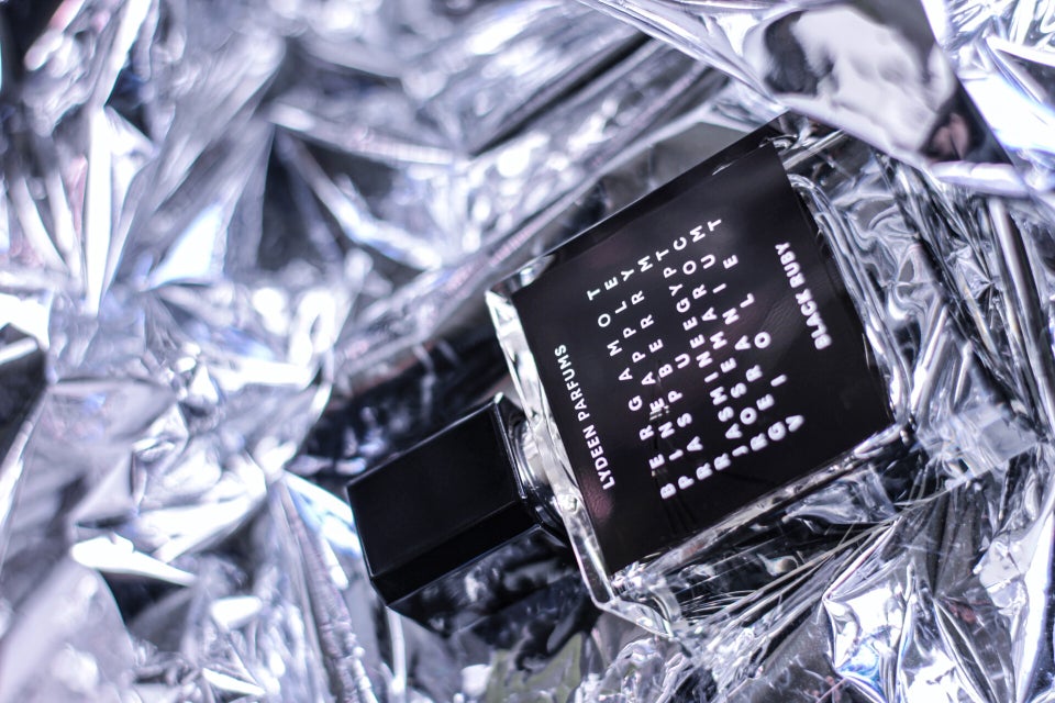 13. Lydeen Parfums Black Ruby in a moody, reflective setting