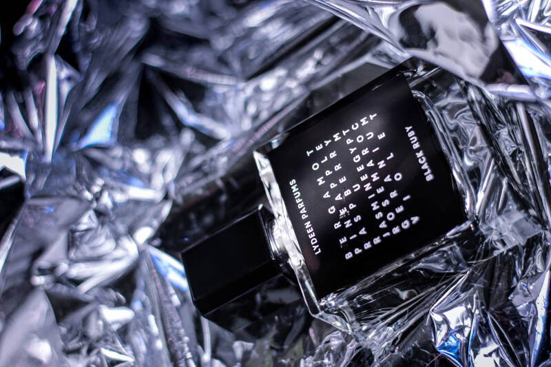 2. Modern perfume styling with high-contrast lighting