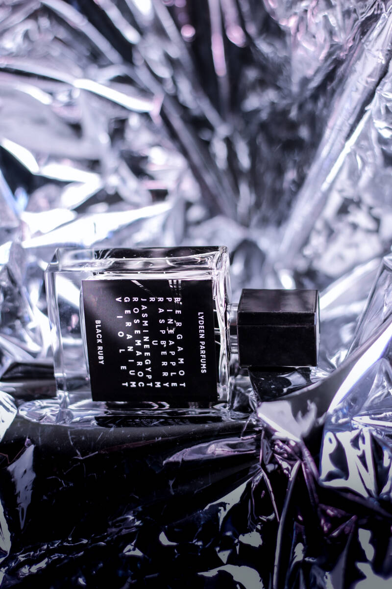 1. Aesthetic image of perfume with bold typography