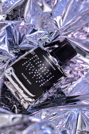 1. Scent bottle labeled Black Ruby placed on abstract foil