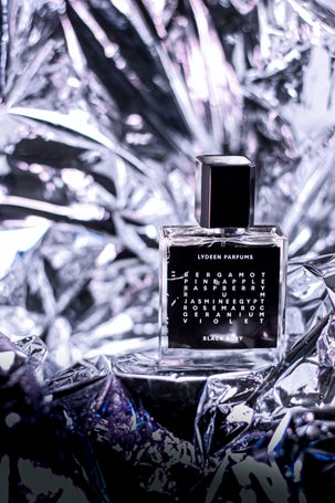 3. Chic perfume shot with holographic reflections