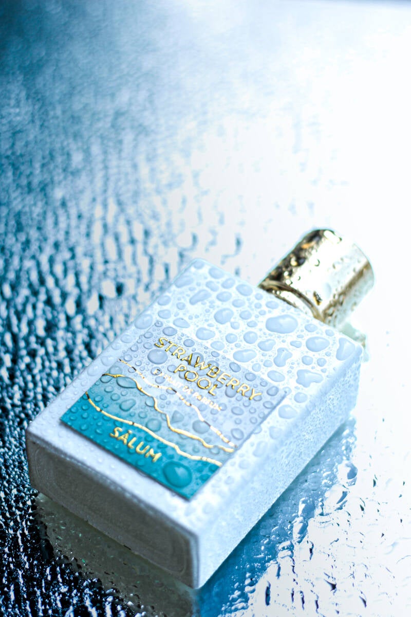 Fragrance photography of Strawberry Pool with golden cap detail