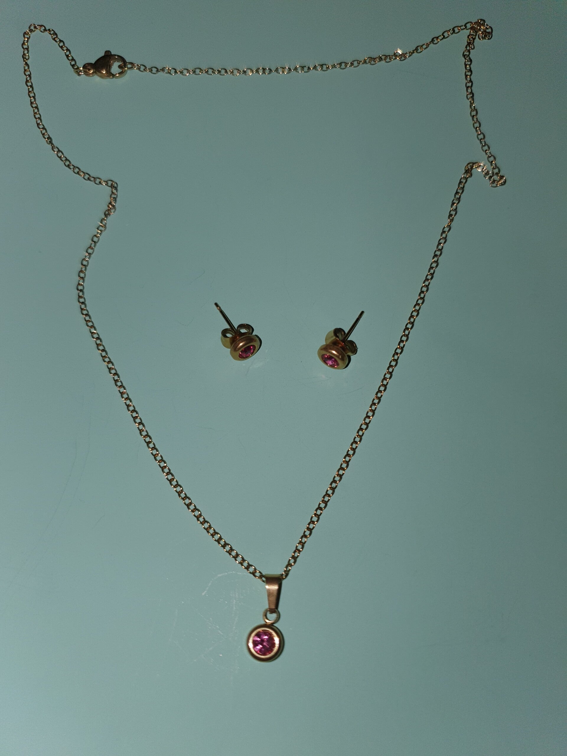 Setje goudkleurig steentje roze