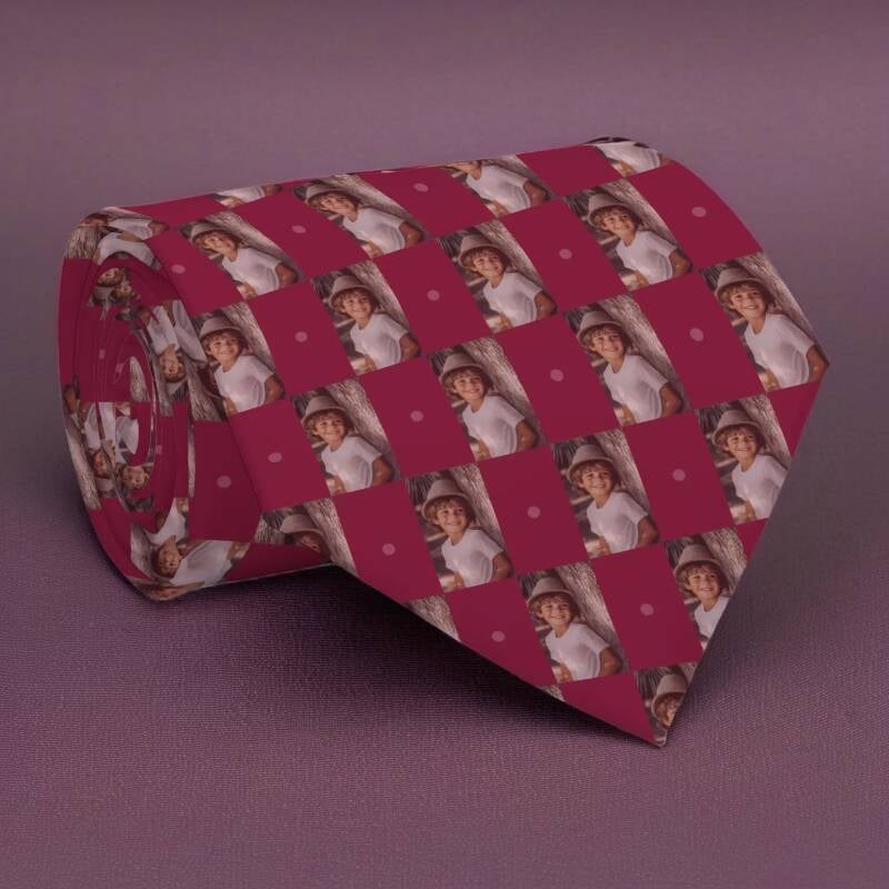 Custom photo patterned necktie featuring vertical photograph of a boy in a burgundy checkerboard pattern.