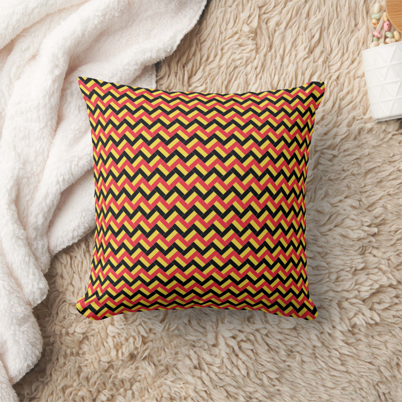 Decorative pillow with a patchwork pattern based on the Belgium national flag.