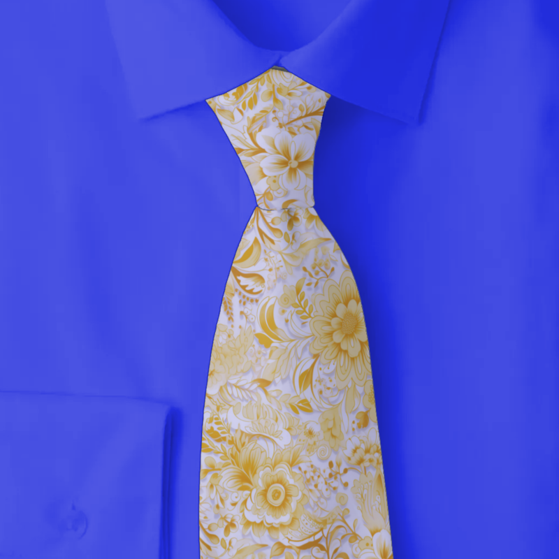 buttercream floral necktie on folded dark blue shirt