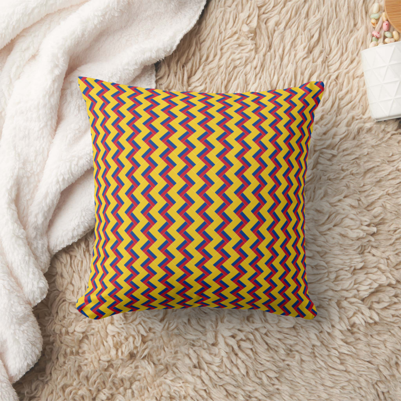 Decorative pillow with a patchwork pattern based on the Colombia national flag.
