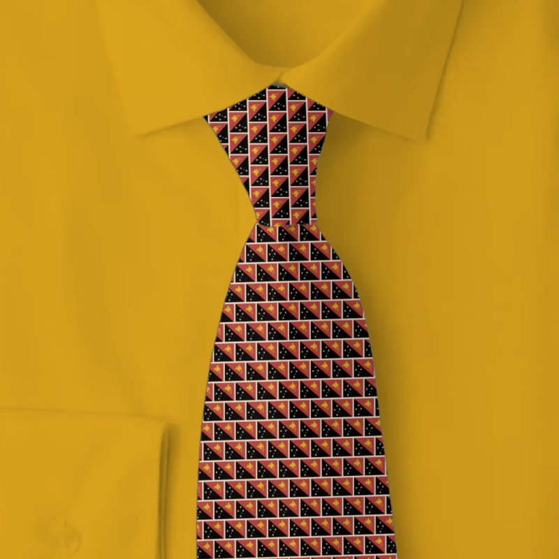 Papua New Guinea flag brick pattern necktie on golden yellow folded shirt