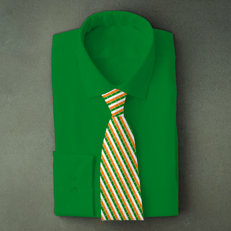 Cote d’Ivoire flag necktie on green folded shirt