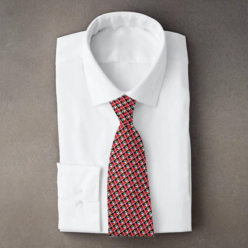 Antigua and Barbuda flag necktie on folded white shirt