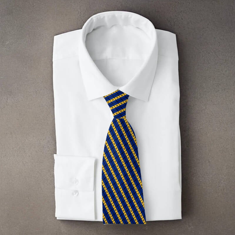 Barbados flag necktie on folded white shirt