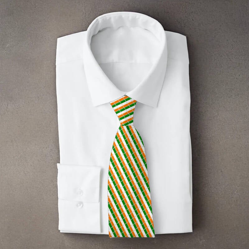 Cote d’Ivoire flag necktie on folded white shirt